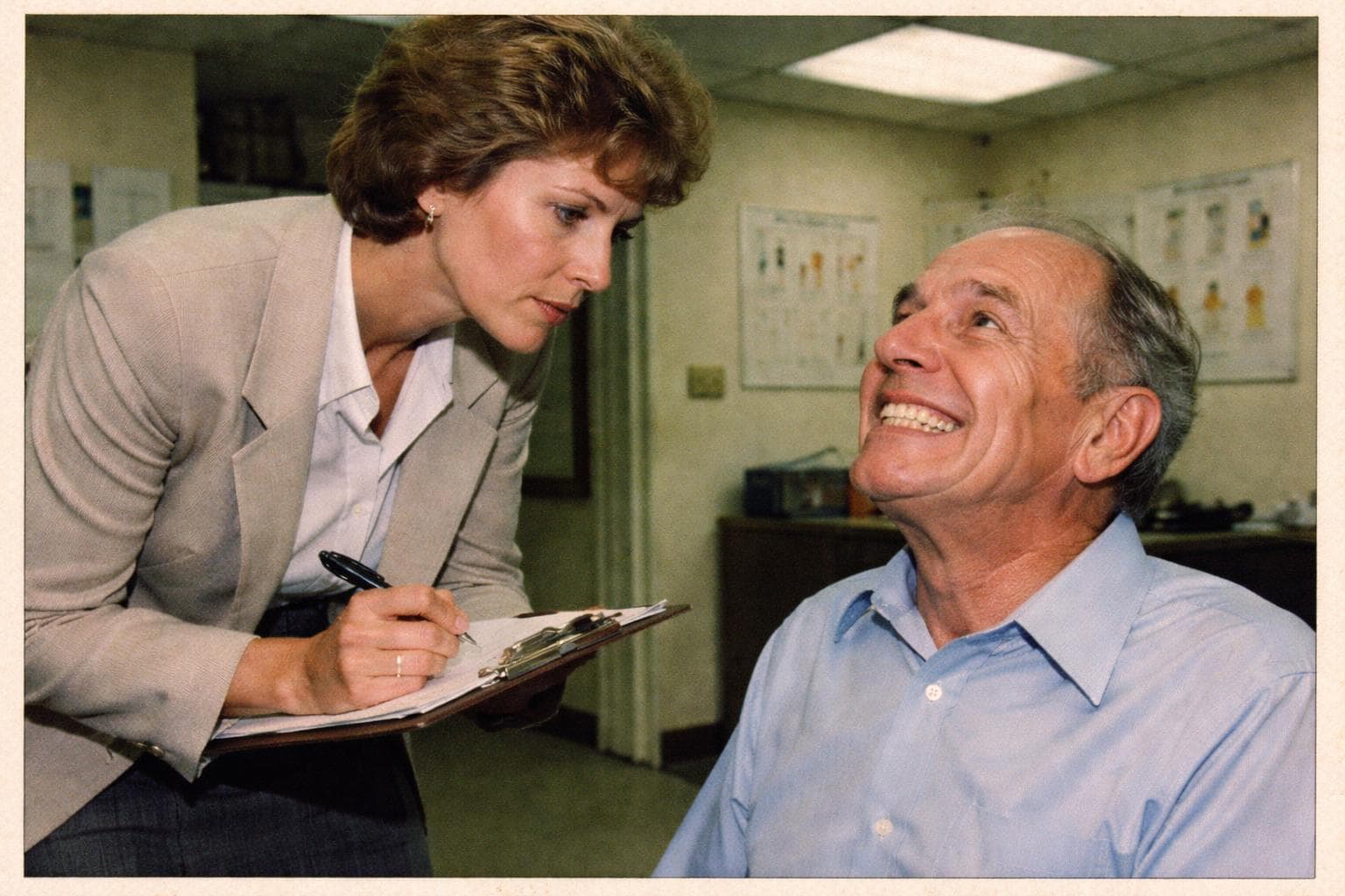 A Dentin Collective Harvest Readiness Consultant reviews a client's enamel score at the Sutherland Mews intake suite. Clients are encouraged to smile for the preliminary assessment.